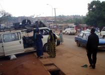 <p> Start of the 200km dirt road trip: loading up the transport van at Yaounde. </p>